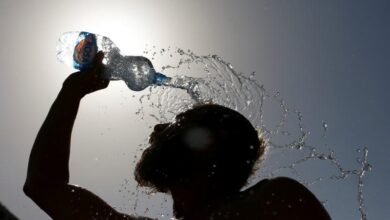 A Man Pours Water On His Face To Cool Off From Hot Weather In Skopje