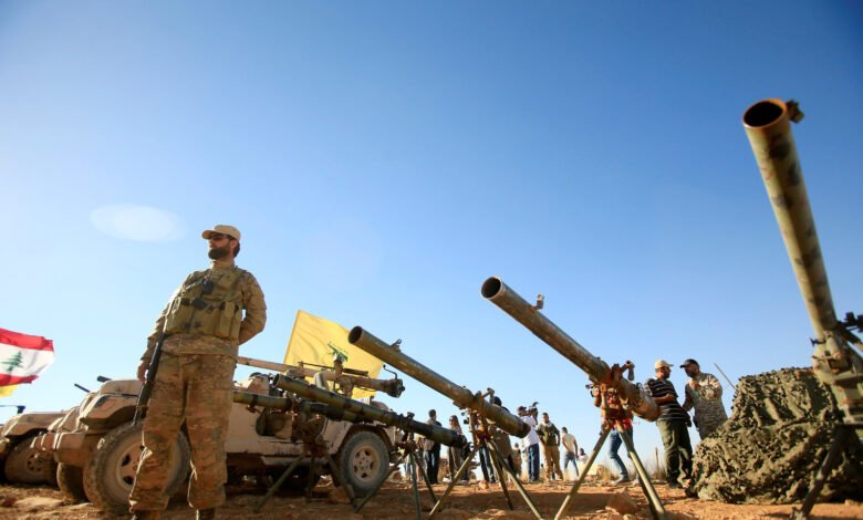 A Hezbollah Fighter Stands In Front Of Anti Tank Artillery At Juroud Arsal